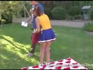 Adorable sexy redhead cheerleader showing tits