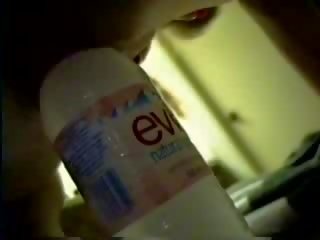 A bottle of purified water brings her to orgasm Video